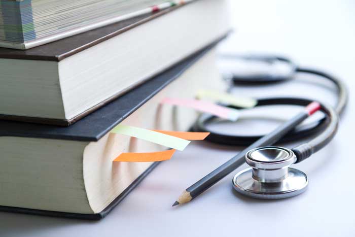 Medical Textbook and Stethoscope